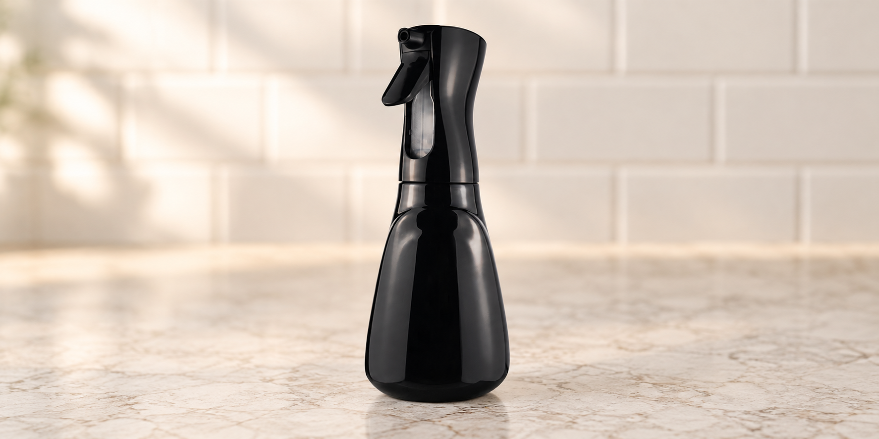 Black foaming spray bottle on a kitchen counter