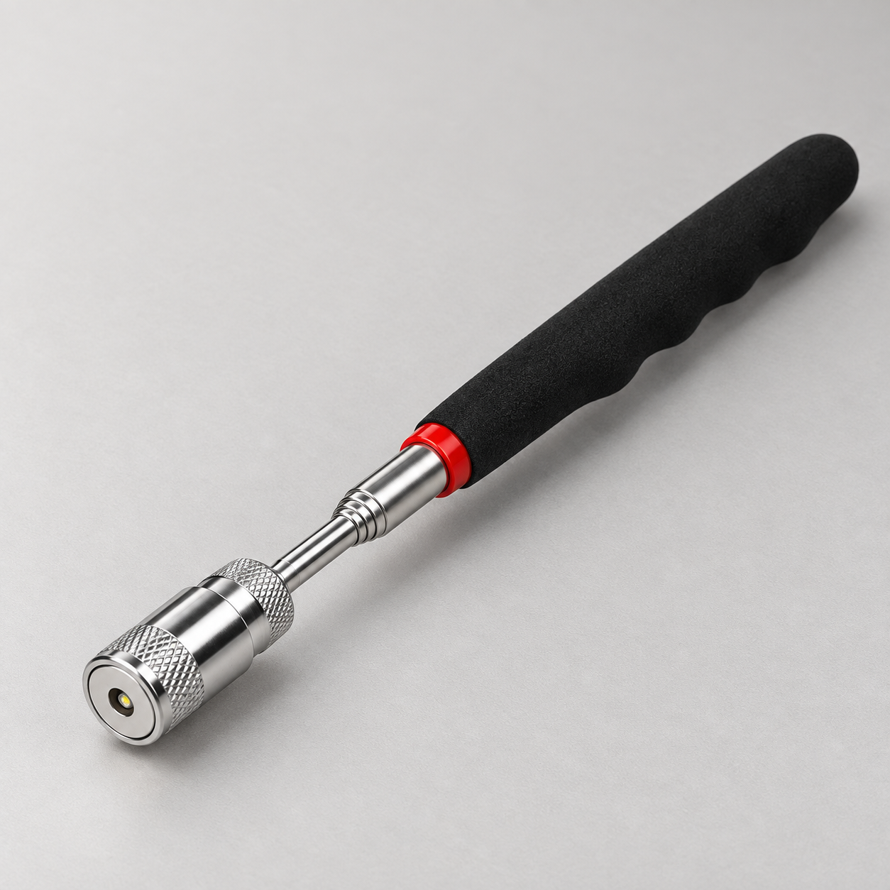 LED magnetic pickup tool with black grip and silver telescopic shaft
