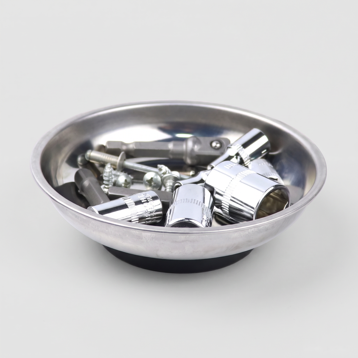 Round stainless steel magnetic parts tray holding sockets, bolts and nuts