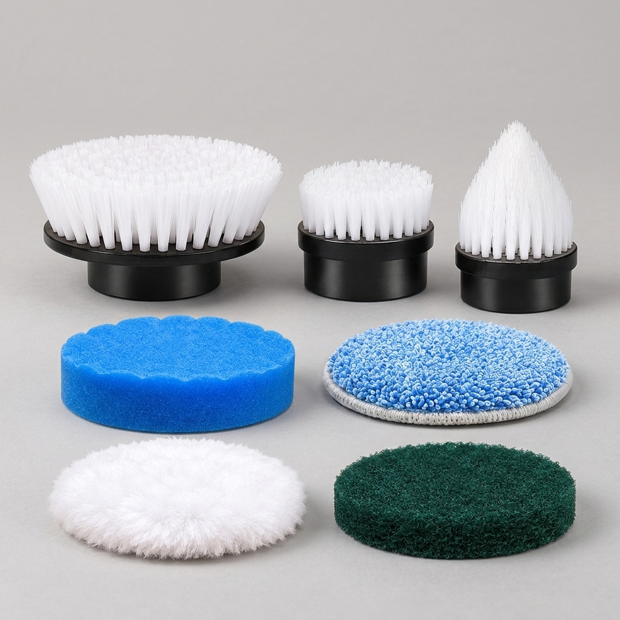 Replacement kit with three white-bristle brushes and four cleaning pads